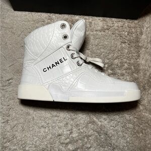 CHANEL Embossed‎ White High-Top Sneakers